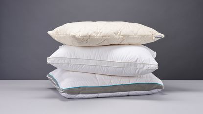 Three of the best pillows for side sleepers piled on top of each other