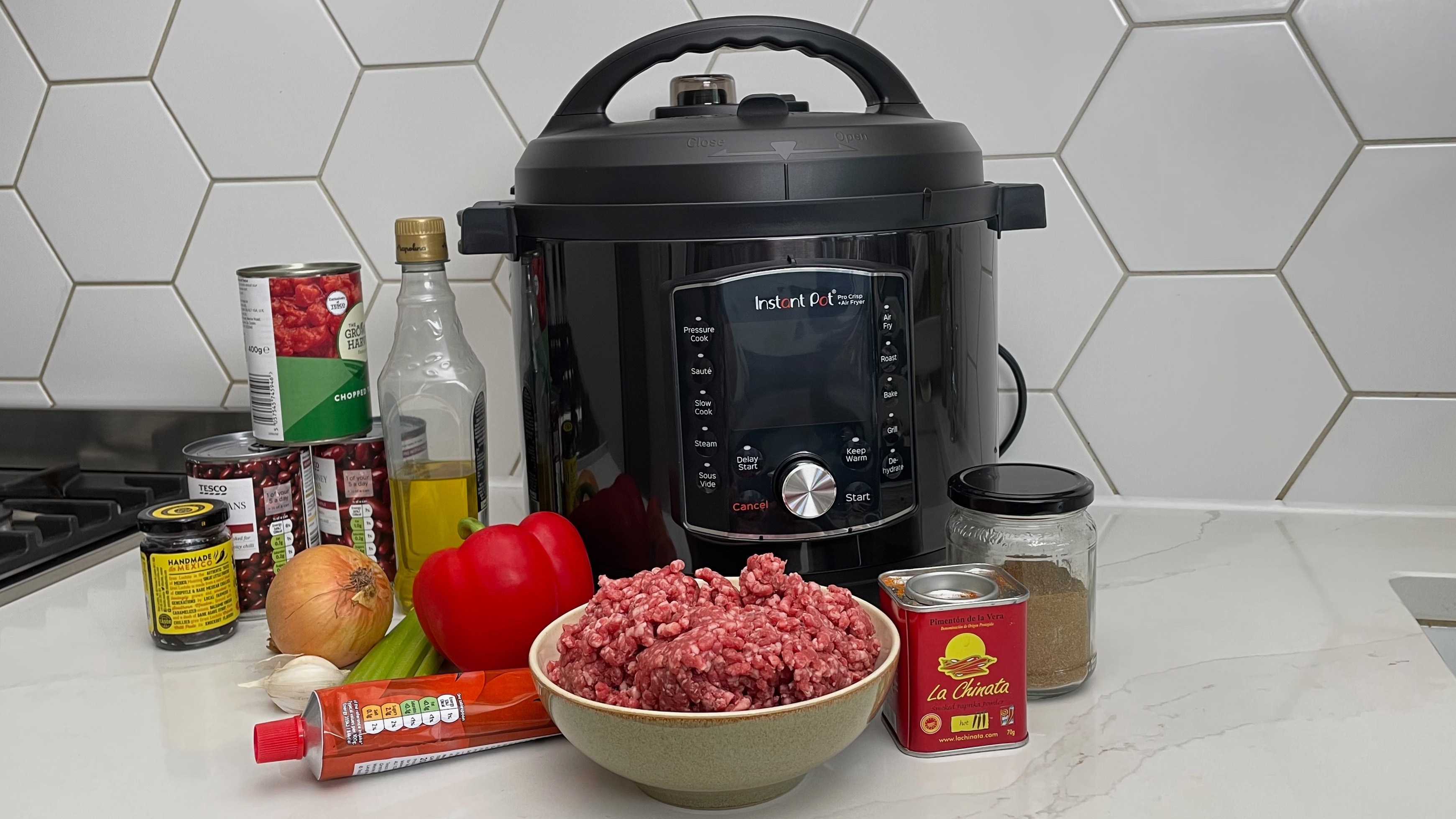 The Instant Pot Pro Crisp with the ingredients to make a slow cooked beef chilli
