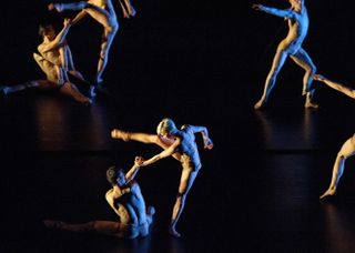 tree of code performance with people dressed in white