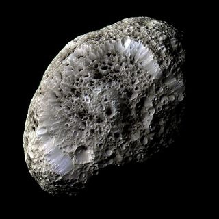 Saturn's moon Hyperion is an irregularly shaped rock that orbits Saturn some 920,300 miles (1.48 million km) above the planet's cloud tops.