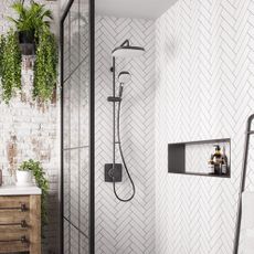 Walk-in shower with white herringbone wall tiles