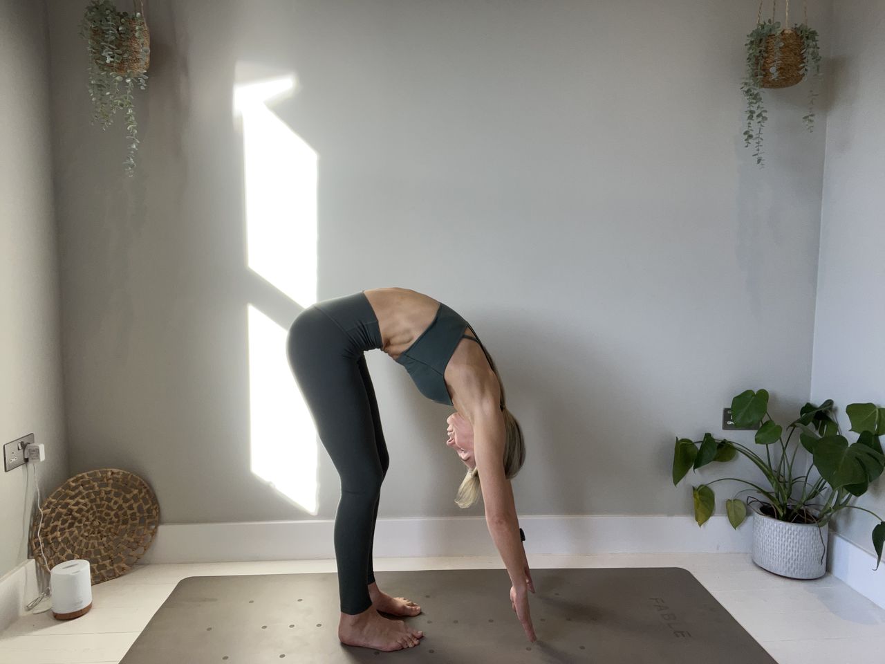 Pilates instructor Gemma Folkard demonstrating the roll down