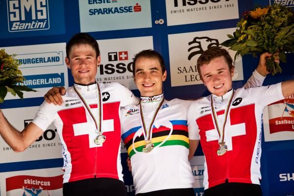 Elite men's world championship cross country podium: Lukas Flueckiger, Nino Schurter, Mathias Flueckiger (all Switzerland)