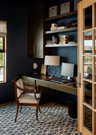 A home office with storage shelves and baskets