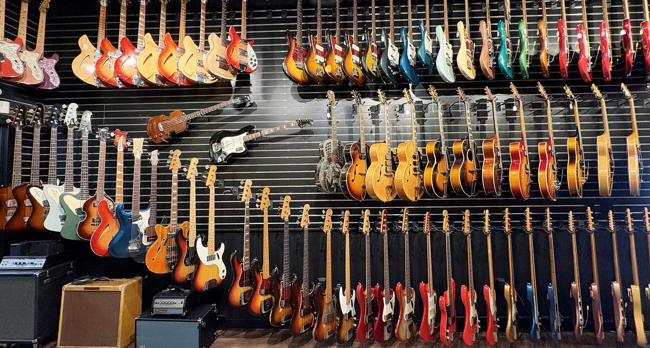 The view from the shop floor at Well Strung Guitars, where the walls are stacked with vintage guitars from Fender, Gibson and more