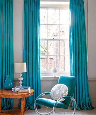 room with sash window and table lamp