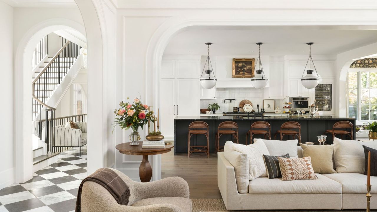 open plan kitchen living room with view of hall and stairs with black and white floor