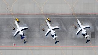Birds-eye image of two planes on a run way 