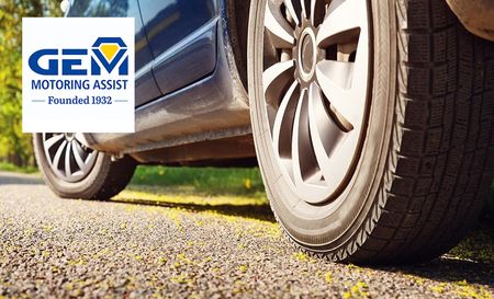 gem motoring assist logo top left with a close up shot of a cars back wheel