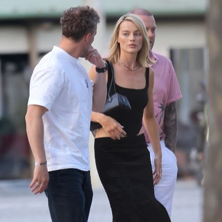 Margot Robbie steps out in a calf-length fish tail skirt and black t-bar high heels.