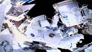 European Space Agency astronaut Luca Parmitano works to repair the Alpha Magnetic Spectrometer on the International Space Station in this view from the helmet camera of his crewmate, NASA astronaut Andrew Morgan, during a spacewalk on Jan. 25, 2020.