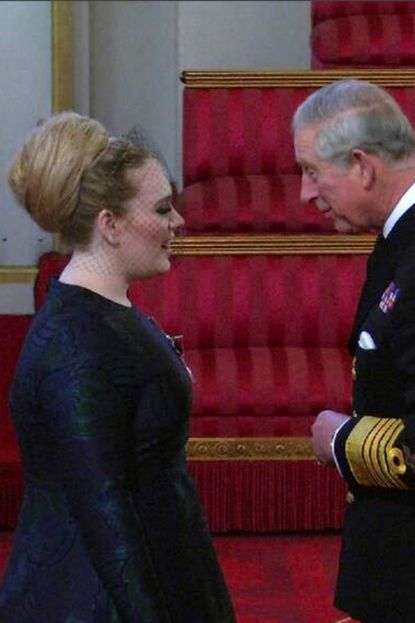 Adele looks lovely in Stella McCartney as she collection her MBE