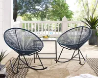 A pair of Acapulco style outdoor rocking chairs in black on a front porch