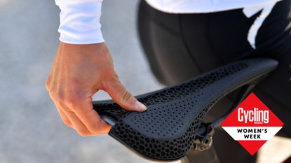 Image shows a female rider with one of the best women's bike saddles