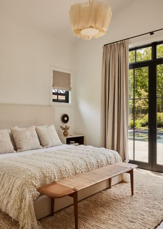 A bright, airy bedroom with a neutral color palette