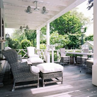 veranda with lanterns and sofa