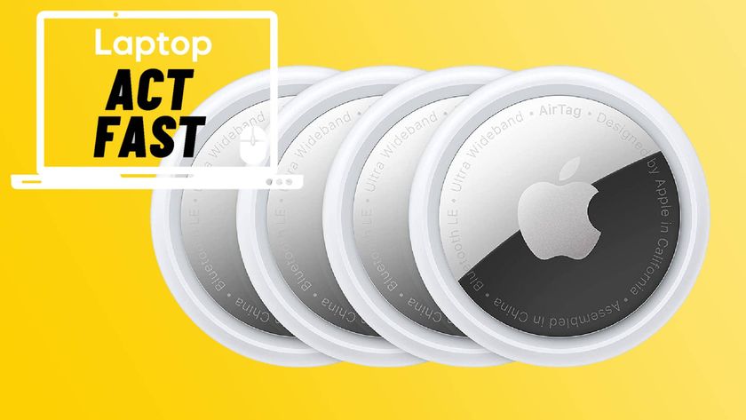 Four Apple AirTags against yellow gradient background