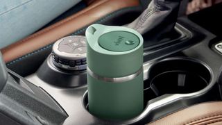 Ninja Sip Perfect travel mug in a cup holder in a car