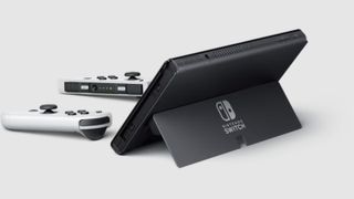 The Nintendo Switch OLED from the back, with its Joy-Cons detached