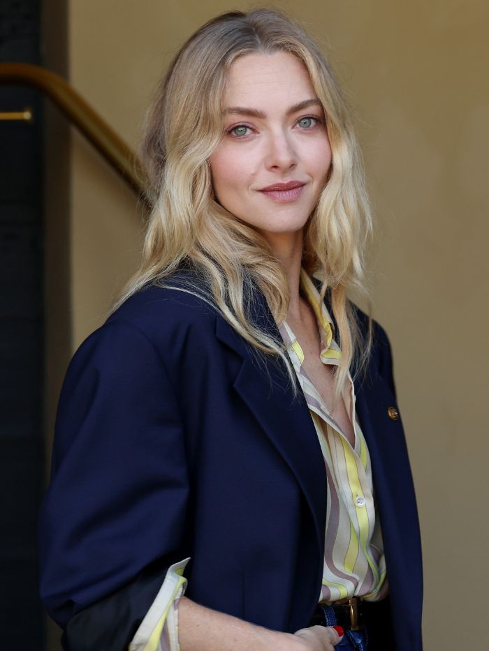 Amanda Seyfried wearing a shirt and blazer with a sandy blonde hairstyle