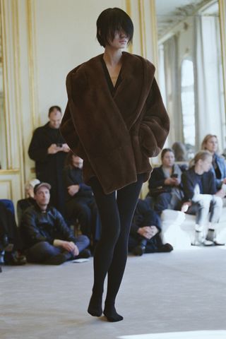 a model walks The Row winter 2025 runway during Paris Fashion Week