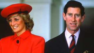 BONN, GERMANY - NOVEMBER 02: Prince Charles, Prince of Wales and Diana, Princess of Wales, wearing a pink/red suit designed by Arabella Pollen and a matching hat designed by Graham Smith of Kangol, smile as they visit Bonn on November 2, 1987 in Bonn, Germany.