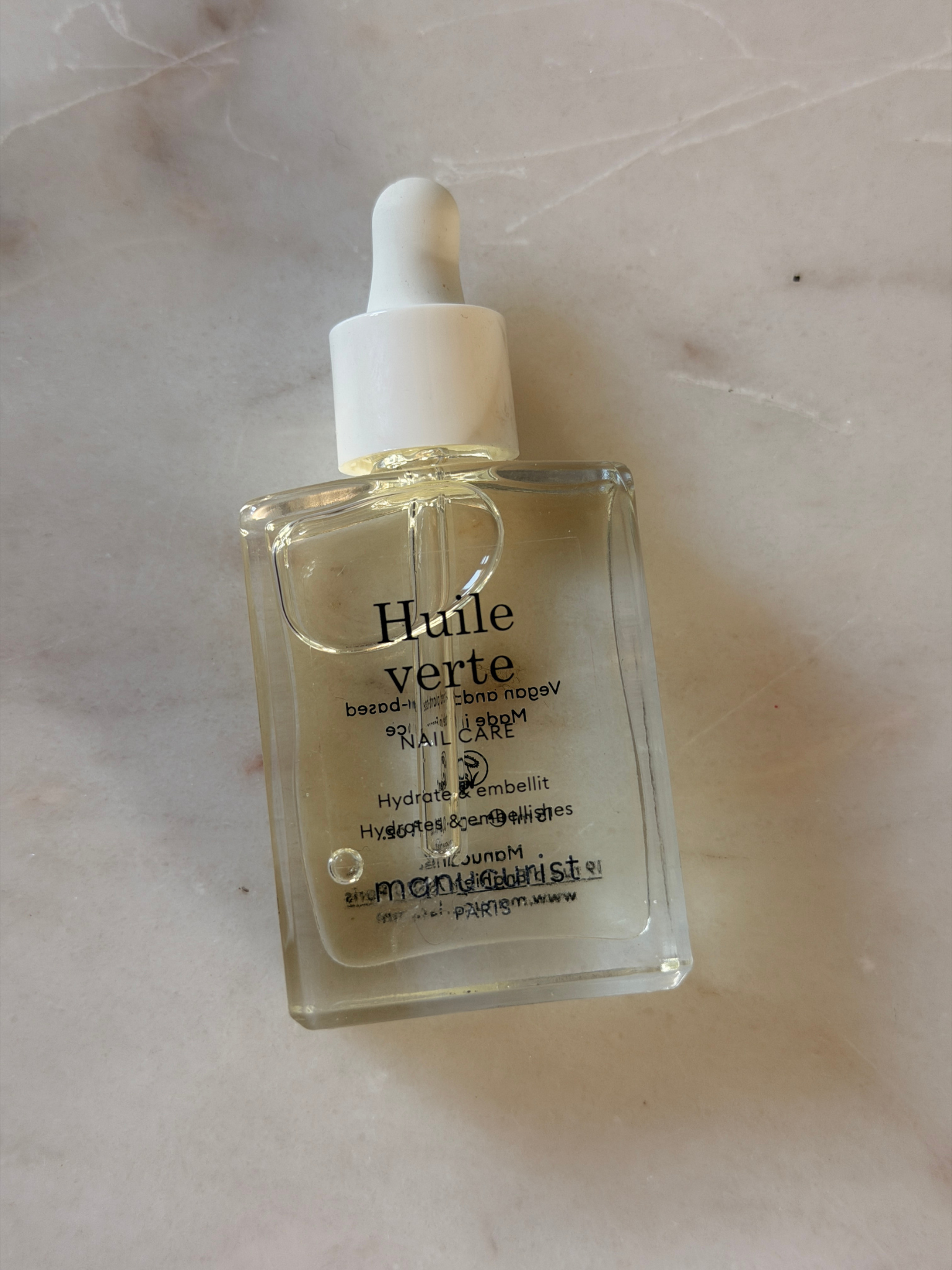 A bottle of Manucurist Huile Verte