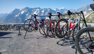 Grand Velo Tours bikes on a rack with mountains behind