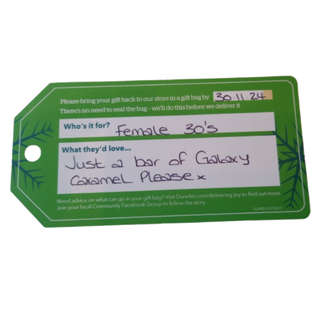 A christmas wish tag requesting a bar of glaxy caramel