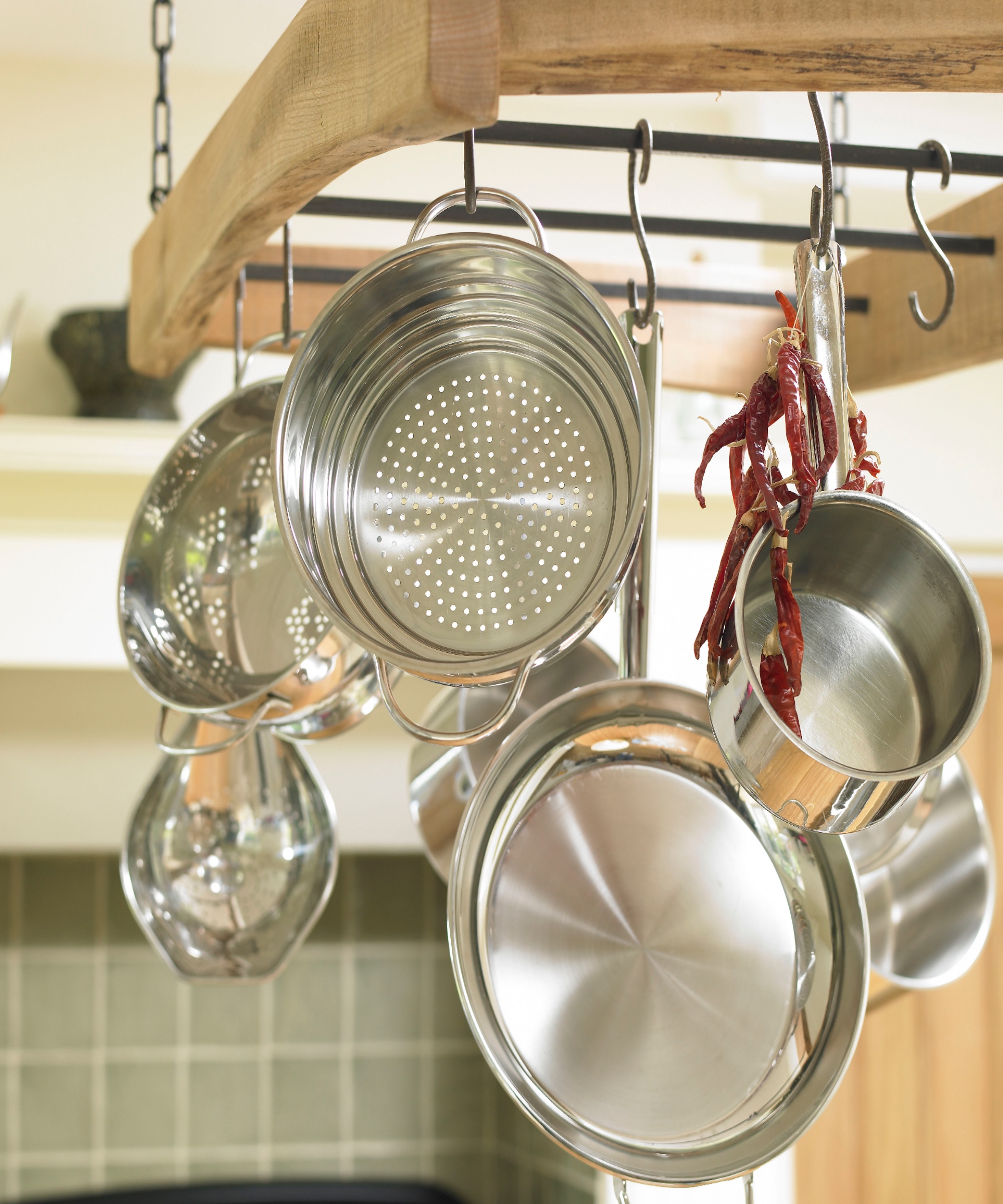 Hanging wooden rack with metal rails and 'S' hooks