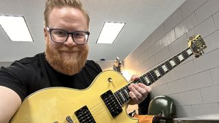 Mike Adams holds Steve Jones’ Sex Pistols Gibson Les Paul