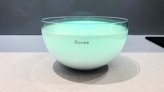Govee Ambient RGBWW Portable Table Lamp illuminated soft green