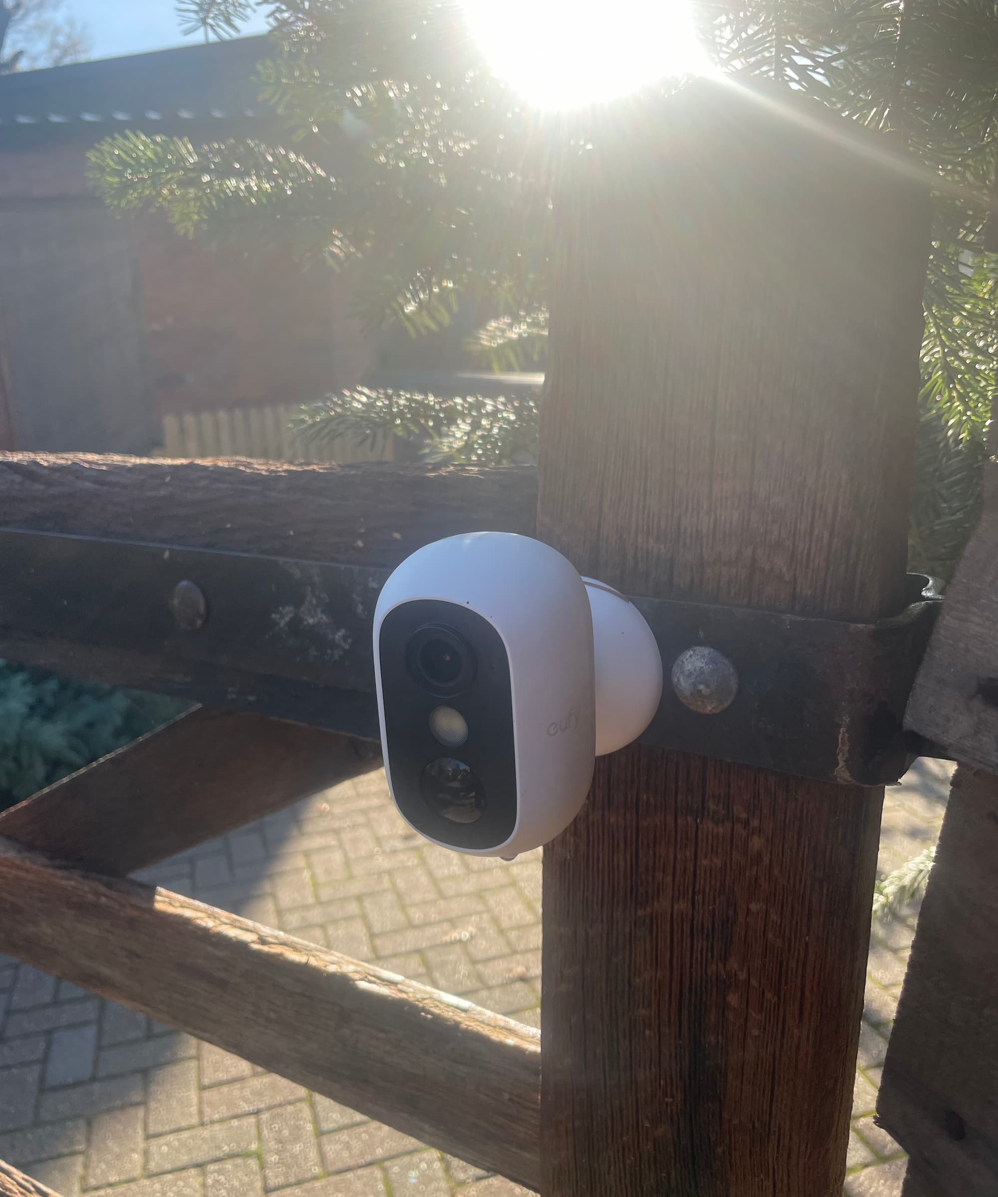 A eufy security camera on a gate