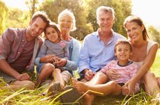 Multi-generation family relaxing together outdoors