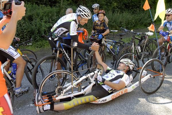 Spanish cycling legend Miguel Indurain shakes hands with Diego Ballesteros prior to their ride together.
