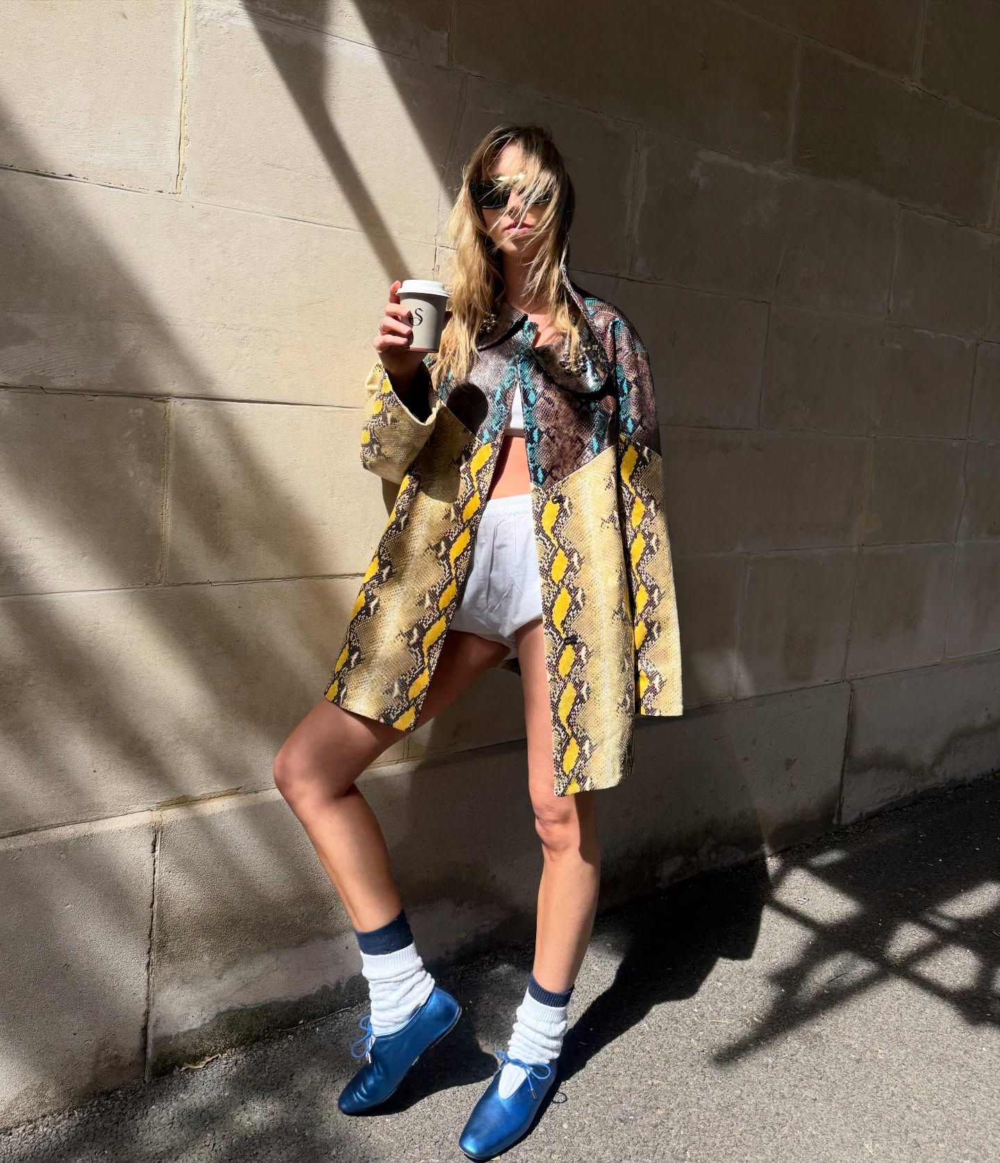 An image of a woman wearing metallic ballet flat trend
