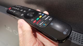 LG C2 remote control held in hand