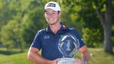 Viktor Hovland with the Memorial Tournament trophy