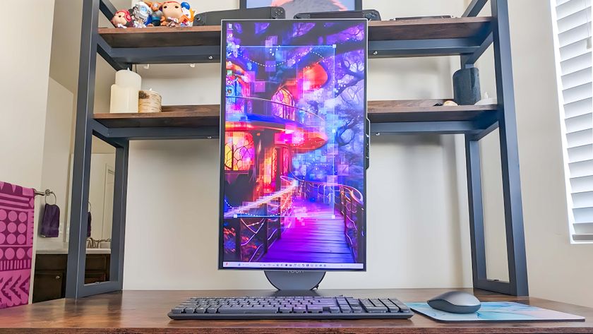 The Lenovo Yoga AIO 27&quot; sitting on a desk with the display in portrait mode.