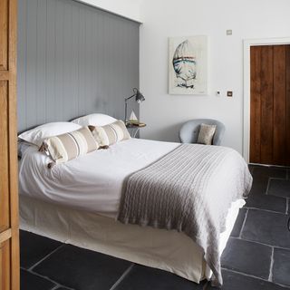 bedroom with grey panelled wall