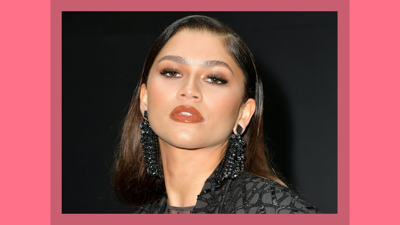 Zendaya pictured with &#039;red wine makeup&#039; as she attends the Valentino Womenswear Spring/Summer 2023 show as part of Paris Fashion Week on October 02, 2022 in Paris, France/ in a burgundy template