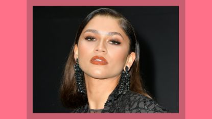 Zendaya pictured with 'red wine makeup' as she attends the Valentino Womenswear Spring/Summer 2023 show as part of Paris Fashion Week on October 02, 2022 in Paris, France/ in a burgundy template