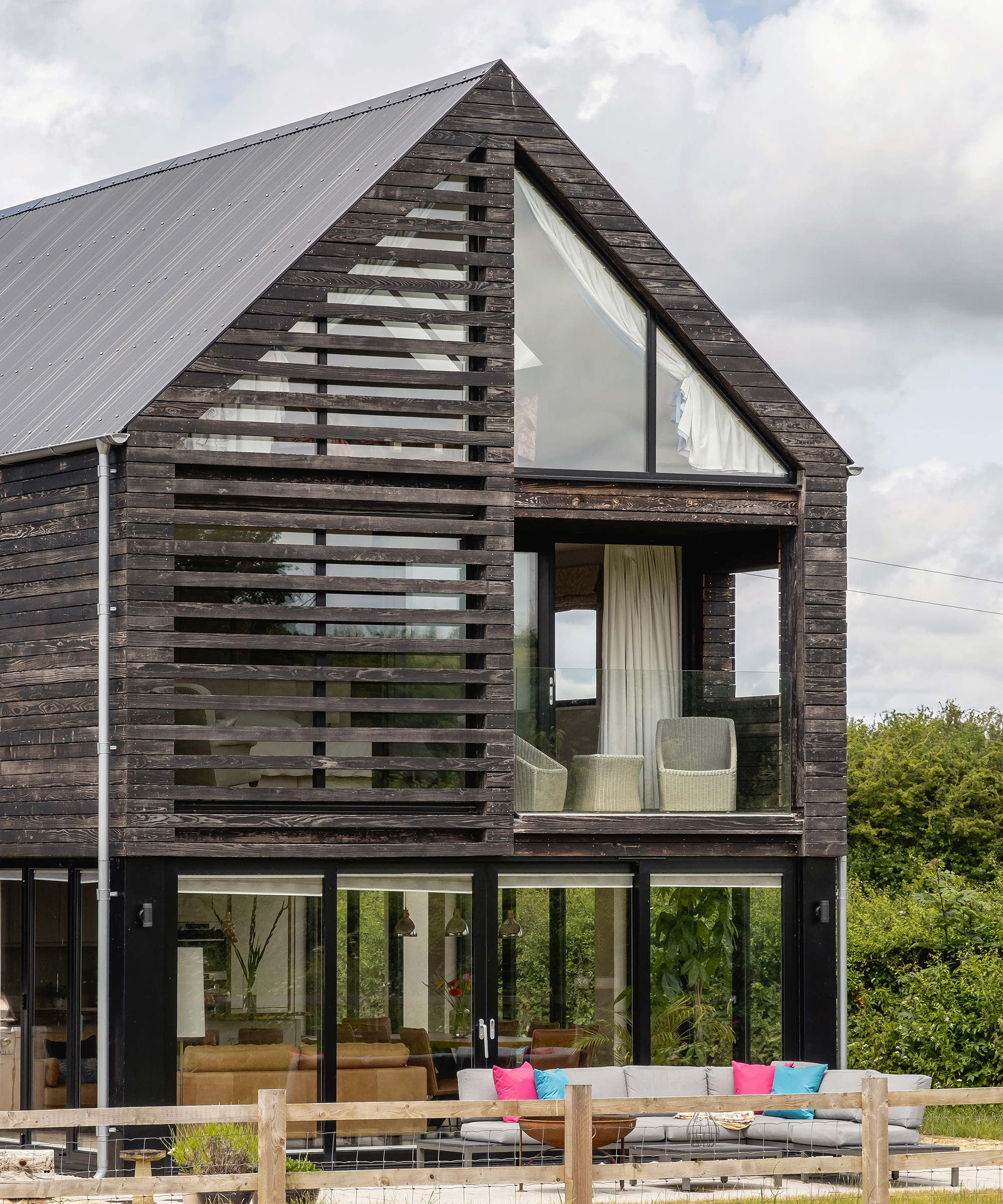 The vista of a pitched roof self build home with three storeys