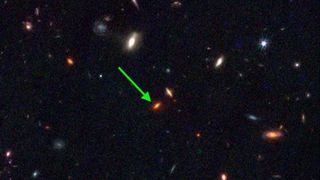 Astronomers believe the first galaxies formed around giant halos of dark matter. But a newly discovered galaxy dating to roughly 13 billion years ago mysteriously appeared long before that process should have occurred.