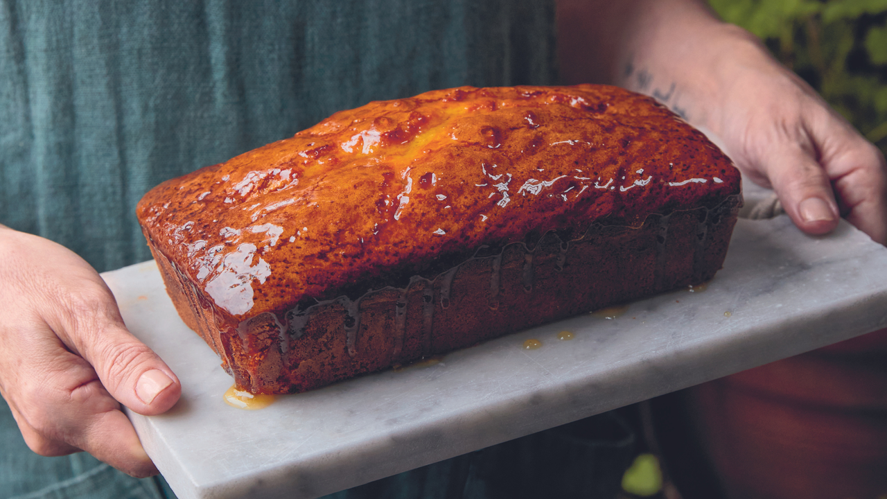 Almond marmalade cake from Sarah Johnson&#039;s &#039;Fruitful&#039; recipe book on a slab of marble.