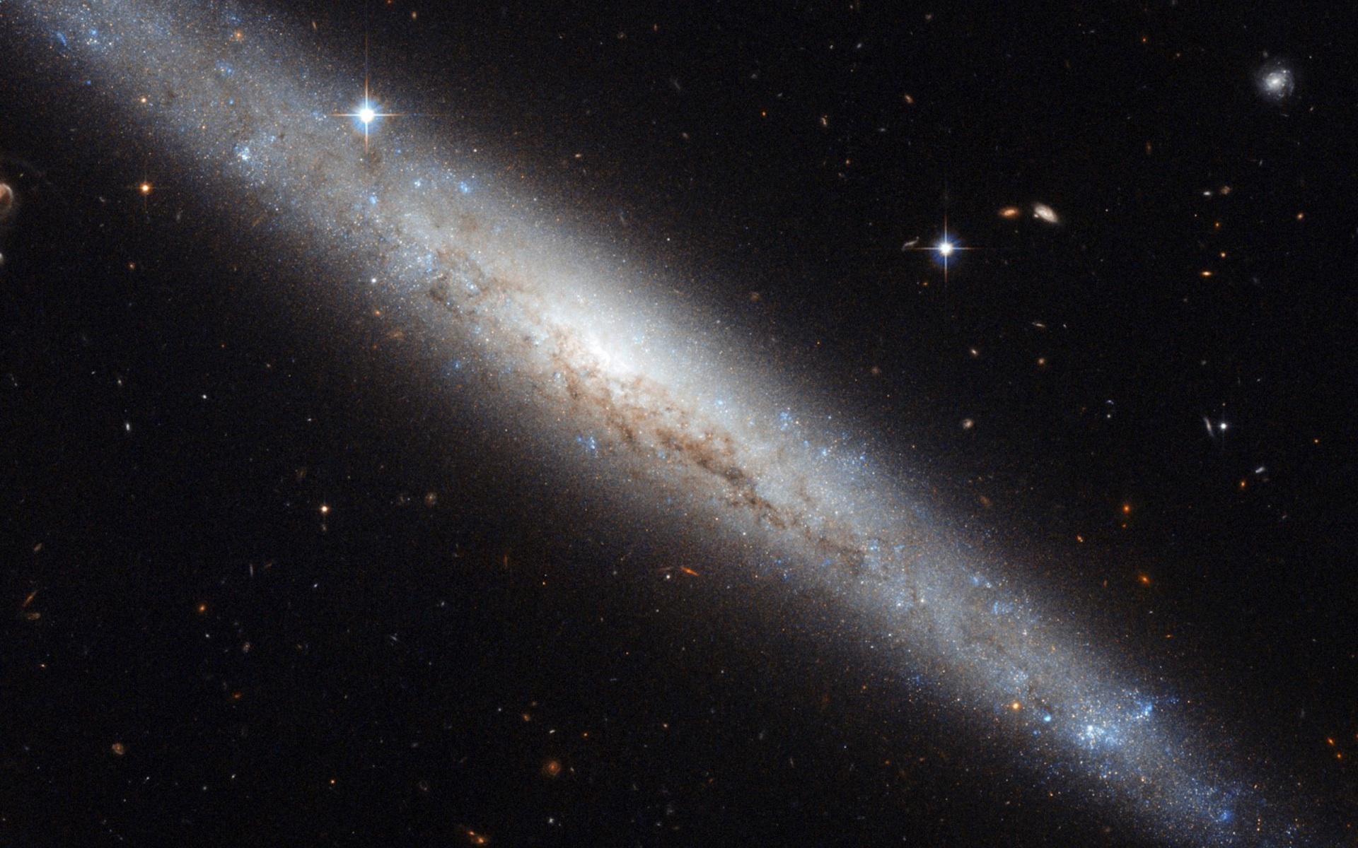 Hubble Portrays a Dusty Spiral Galaxy