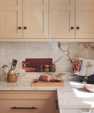 pale yellow kitchen with marble