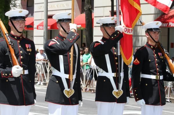 The Marine Corps Honour Guard presents the riders to start today's race.