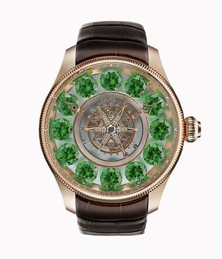 Gucci Watch with green diamonds