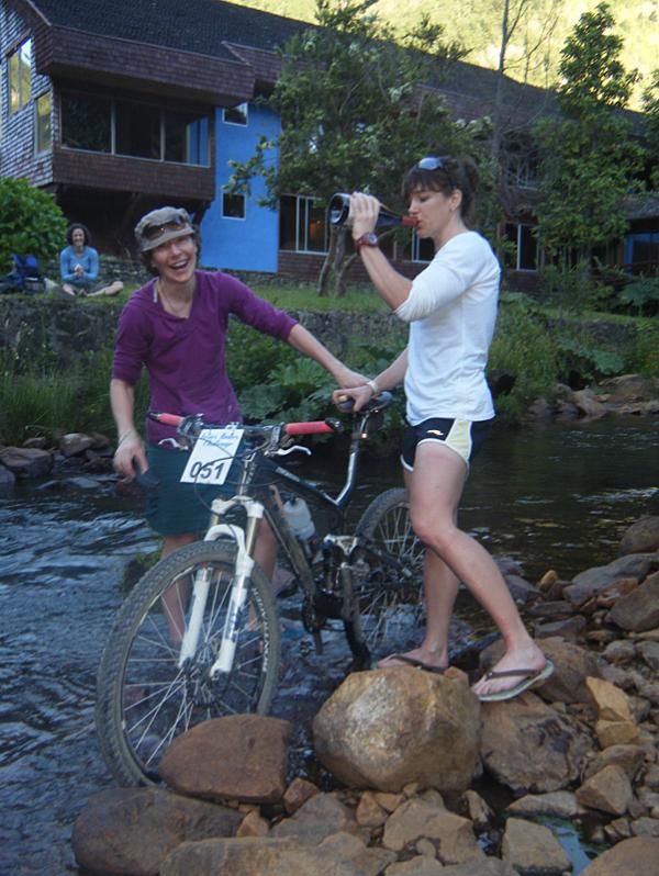 A great example of our teamwork: I hold the bike and drink wine while Jenny washes.